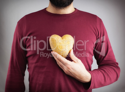 Man with a potato shaped heart on his chest.