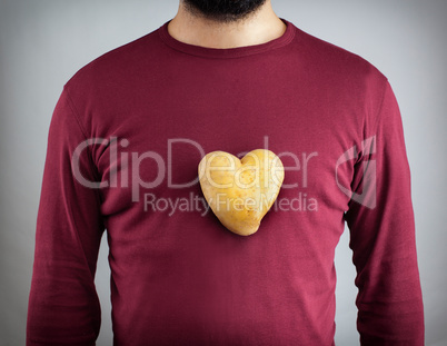 Man with a potato shaped heart on his chest.