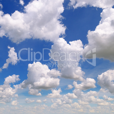 white cumulus clouds against the blue sky