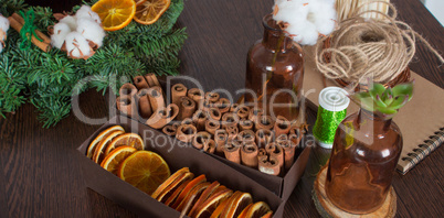 Cinnamon and dried oranges, brown bottles witn cotton, part of c