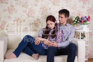 Couple sitting on the sofa together