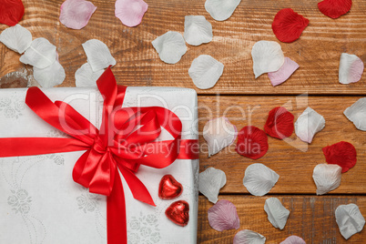 Valentines Day gift and hearts  on wooden background