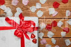Valentines Day gift and hearts  on wooden background