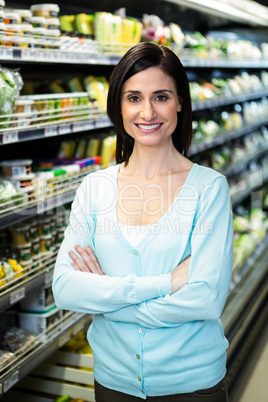 Smiling woman with arms crossed