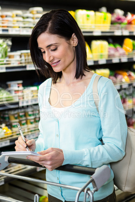 Smiling woman checking list