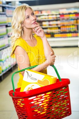 Thoughtful woman with basket
