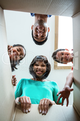 Happy family looking into a box