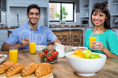 Happy couple having breakfast