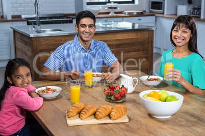 Happy family having breakfast