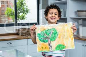 Cute child showing a drawing