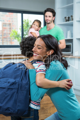 Mother hugging her son