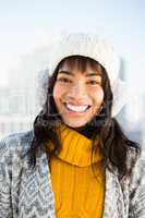 Portrait of smiling woman wearing winter clothes