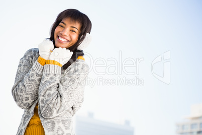Portrait of smiling woman wearing winter clothes