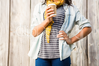 Mid section of a smiling casual woman