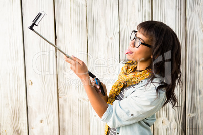 Casual smiling woman taking a selfie