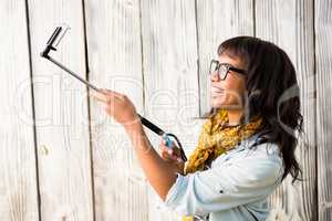 Casual smiling woman taking a selfie