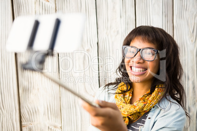 Casual smiling woman taking a selfie