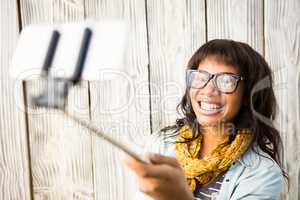 Casual smiling woman taking a selfie