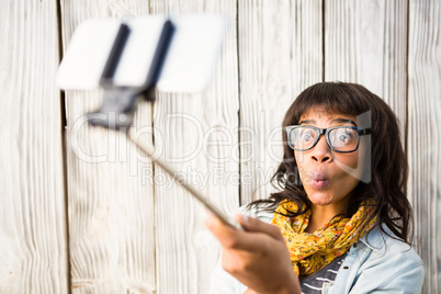 Casual smiling woman taking a selfie