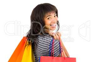 Rear view of a casual woman holding shopping bags