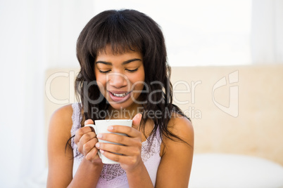 Casual woman holding a cup of coffee