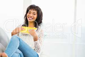 Casual smiling woman holding a book