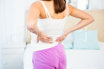 Rear view of a woman with back pain