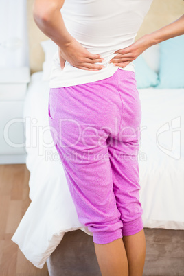 Rear view of a woman with back pain