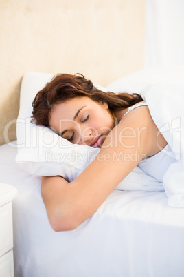 Sleepy woman in her bed