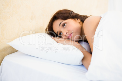 Sleepy woman in her bed