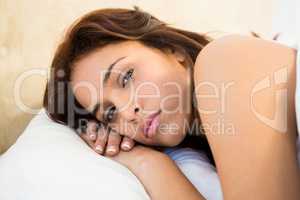 Sleepy woman in her bed