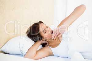 Asleep woman lying on her bed