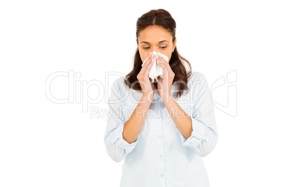 Woman blowing nose with tissue paper