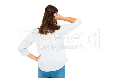 Rear view of woman scratching her head