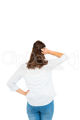 Rear view of woman scratching her head