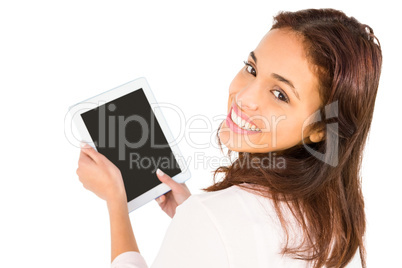 Smiling casual woman using her tablet pc