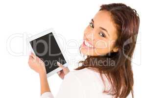 Smiling casual woman using her tablet pc