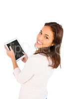 Smiling casual woman using her tablet pc