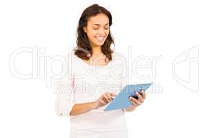 Casual smiling woman using tablet