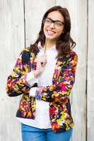 Smiling hipster woman with pencil