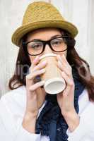 Hipster woman with take-away coffee