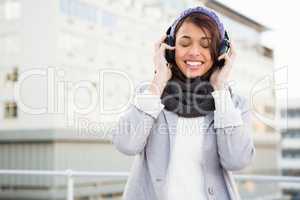 Happy woman listening to music