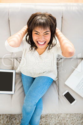 Woman with her hands behind her head