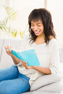 Pretty woman reading on couch Pretty woman reading on couch