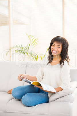 Pretty woman reading on couch Pretty woman reading on couch