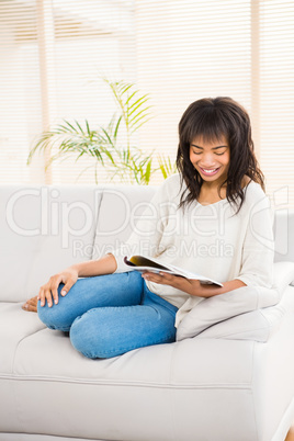 Pretty woman reading on couch Pretty woman reading on couch