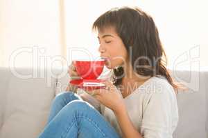 Pretty woman enjoying a cappuccino