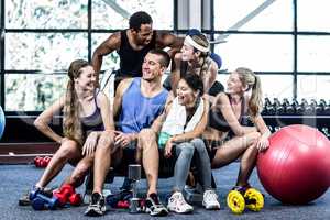 Smiling fitness class posing together