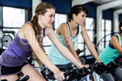 Fit woman working out at spinning class