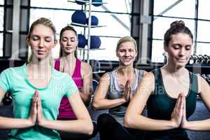 Fit group doing yoga